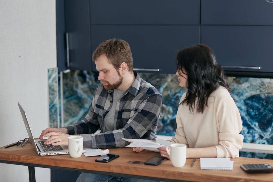 A couple reviewing household finances together at home