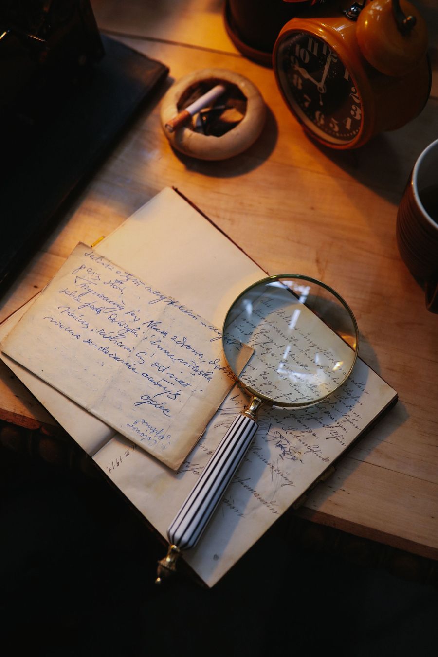 A magnifying glass over documents — reading the fine print
